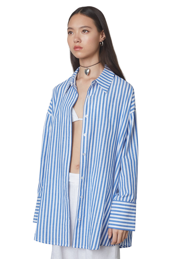 Tony Oversized Shirt in Cobalt: Oversized button down striped linen shirt with a hidden placket. Side view.