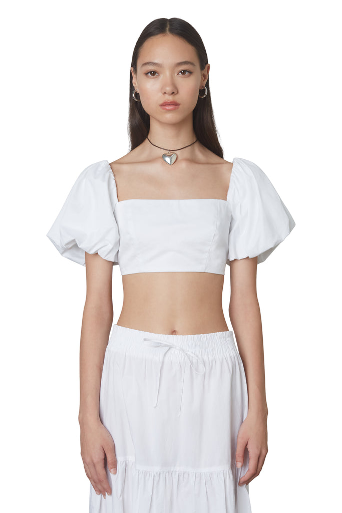 julianne top in white: Puff sleeve fitted crop top with hook and eye closures at back. Fully lined front view