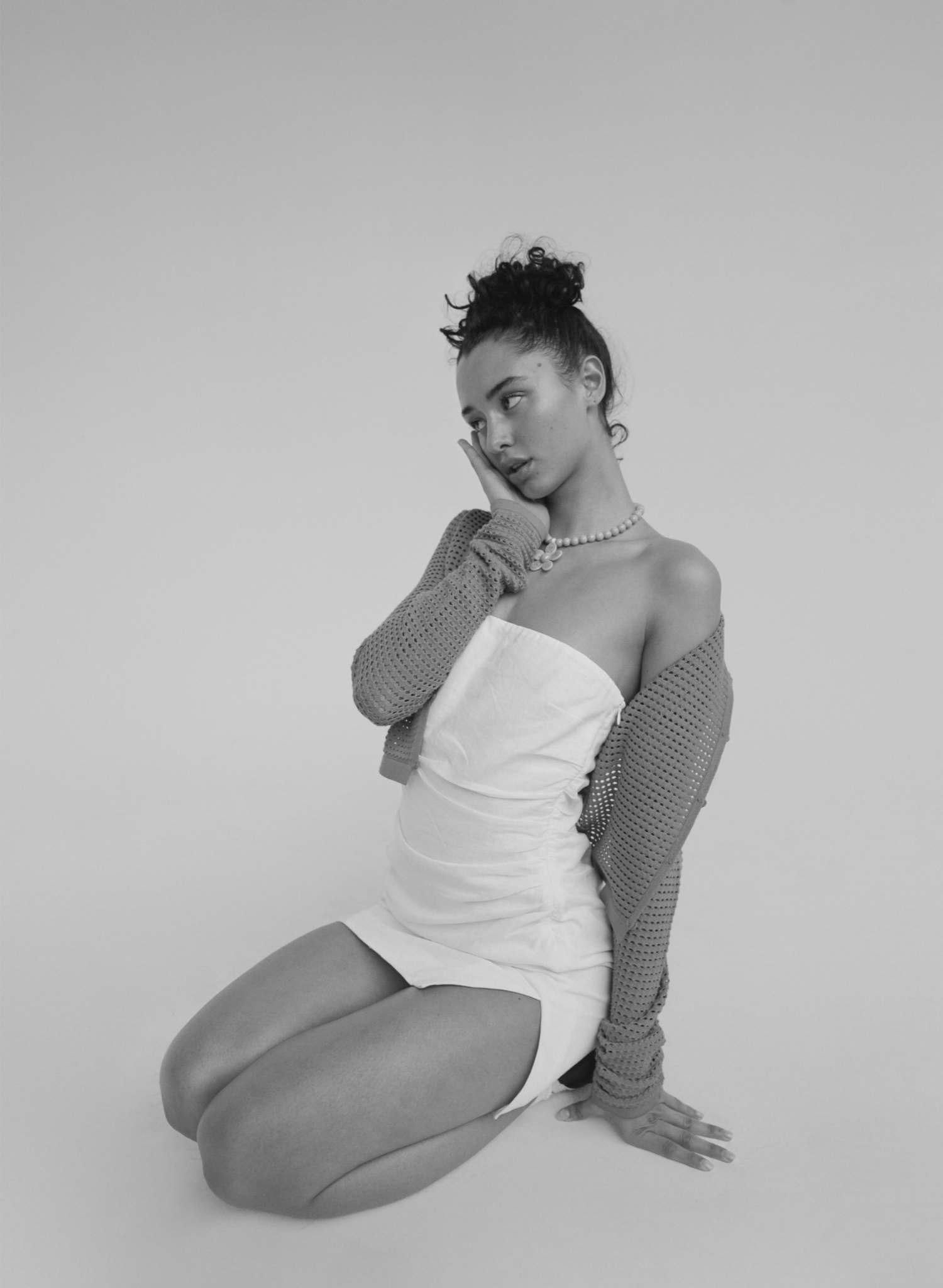 Zenon Dress in White: Strapless linen mini dress with shirring on the sides and a side slit. Fully lined. Front View.