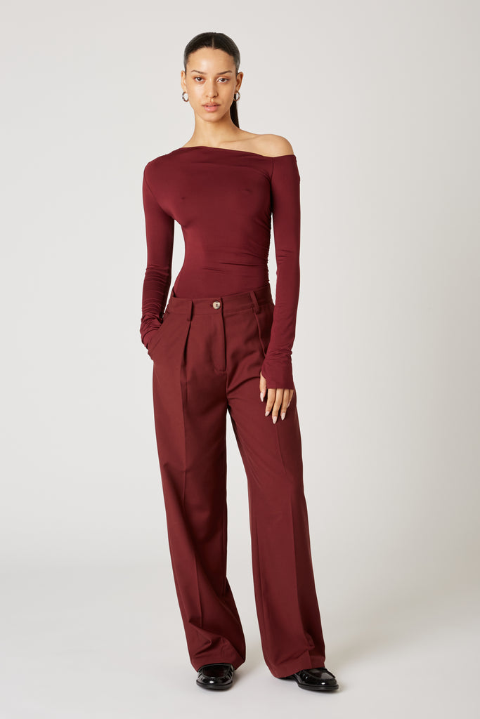 Sly Pant in oxblood front view