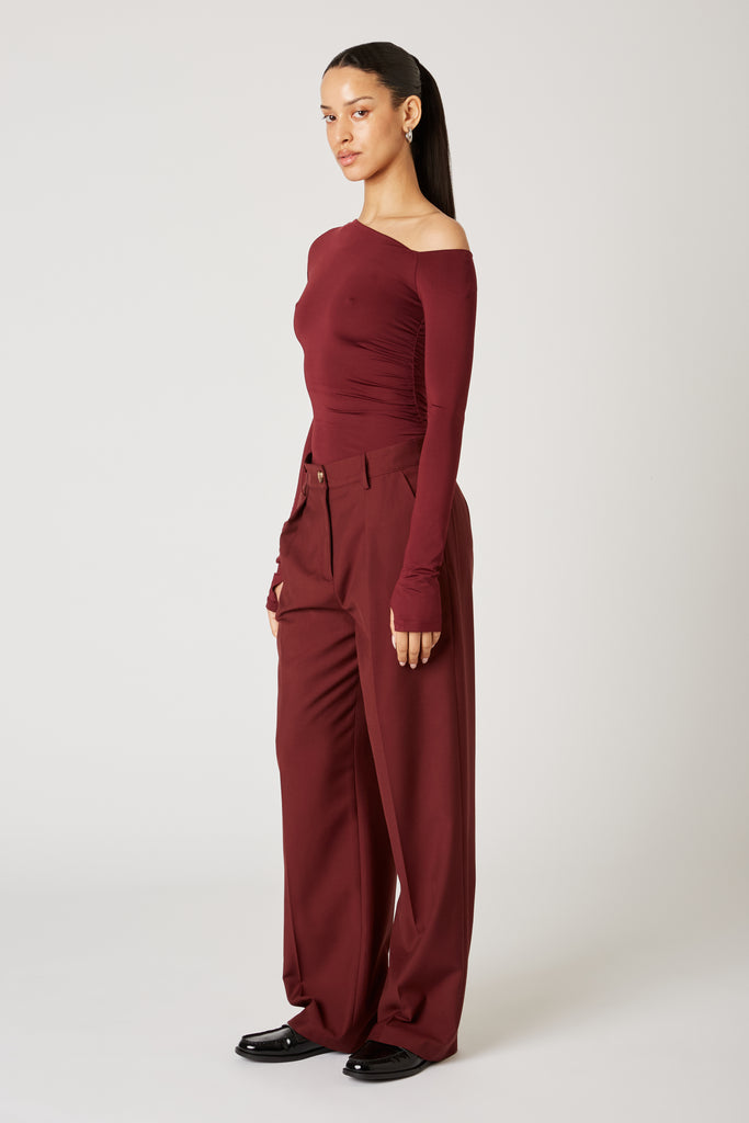 Sly Pant in oxblood side view