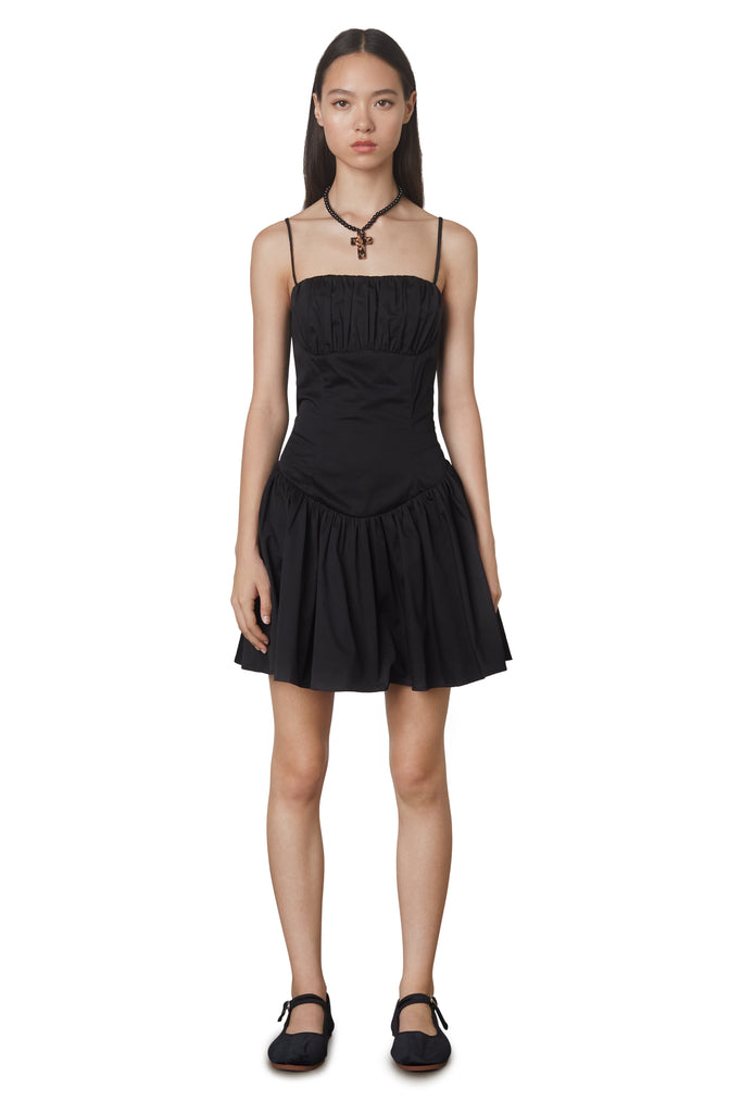 Puglia Dress in black: Poplin drop waist corset mini dress featuring a ruching detail at bust. Fully lined. front view