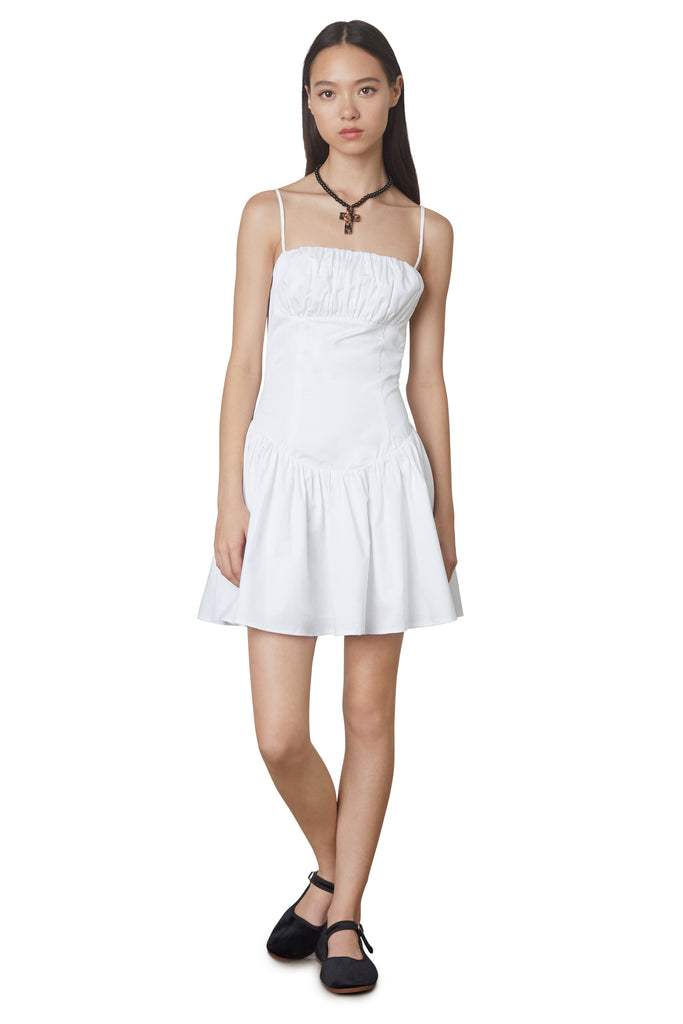 Puglia Dress in white: Poplin drop waist corset mini dress featuring a ruching detail at bust. Fully lined. front view 2