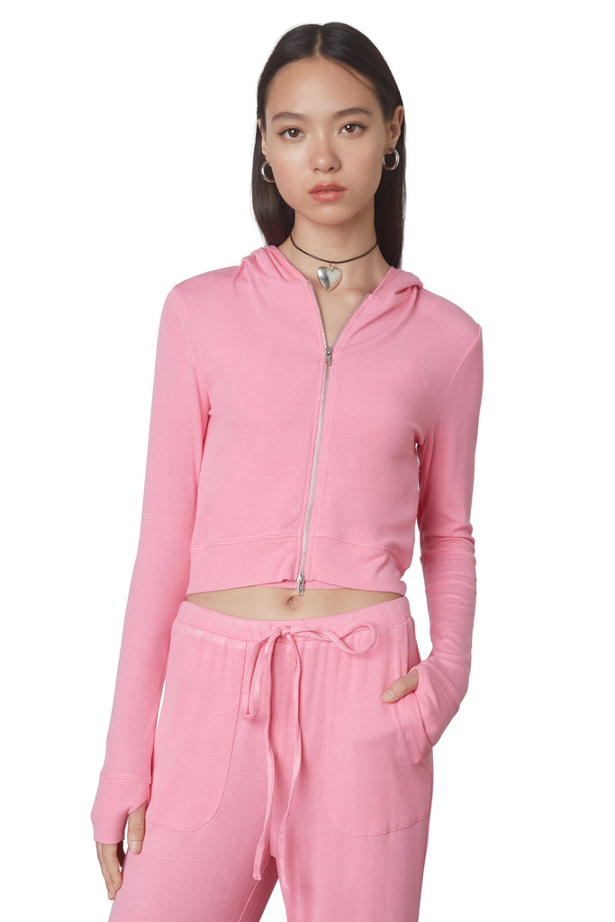 Cropped Hacci Hoodie in Bubble Gum: Form fitting cropped ribbed zip up hoodie with double zipper detail and thumb holes. Front view 2.