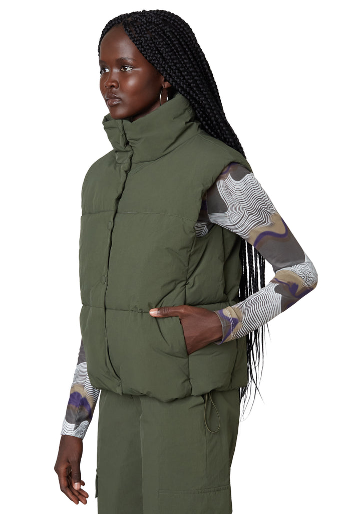 nylon puffer vest in olive side view