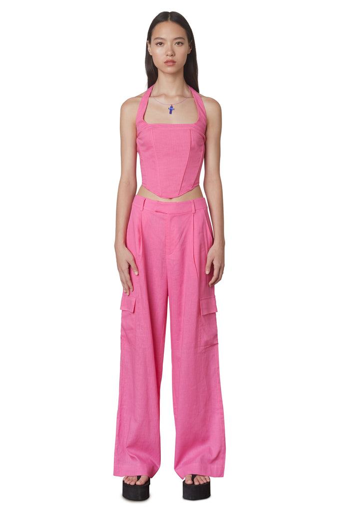 Campari Pant in Pink: Mid-rise linen trouser featuring a wide leg and cargo pocket detailing. Unlined. Front View.