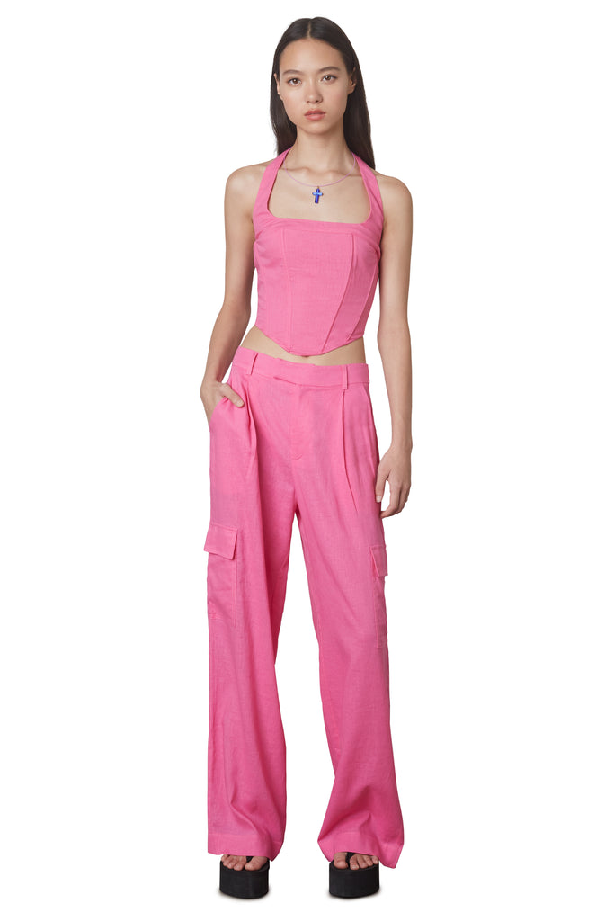 Campari Pant in Pink: Mid-rise linen trouser featuring a wide leg and cargo pocket detailing. Unlined. Front View.