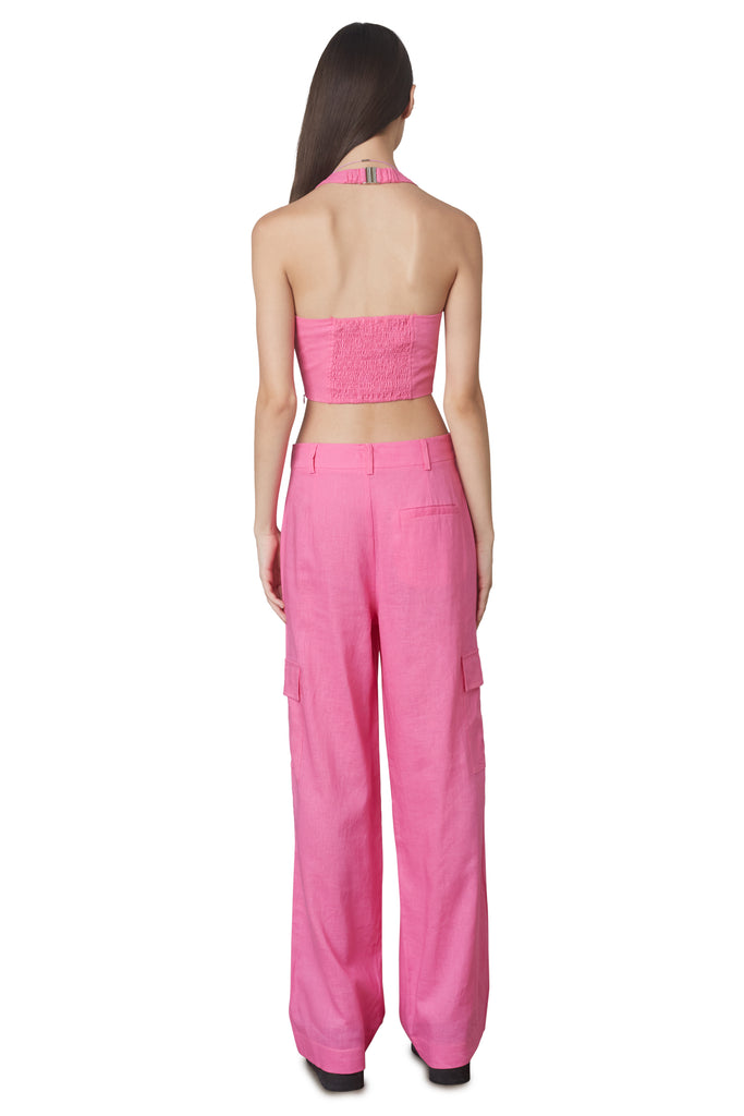 Campari Pant in Pink: Mid-rise linen trouser featuring a wide leg and cargo pocket detailing. Unlined. Back View.
