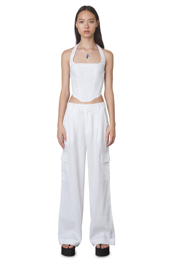 Campari Pant in White: Mid-rise linen trouser featuring a wide leg and cargo pocket detailing. Unlined. Front View.