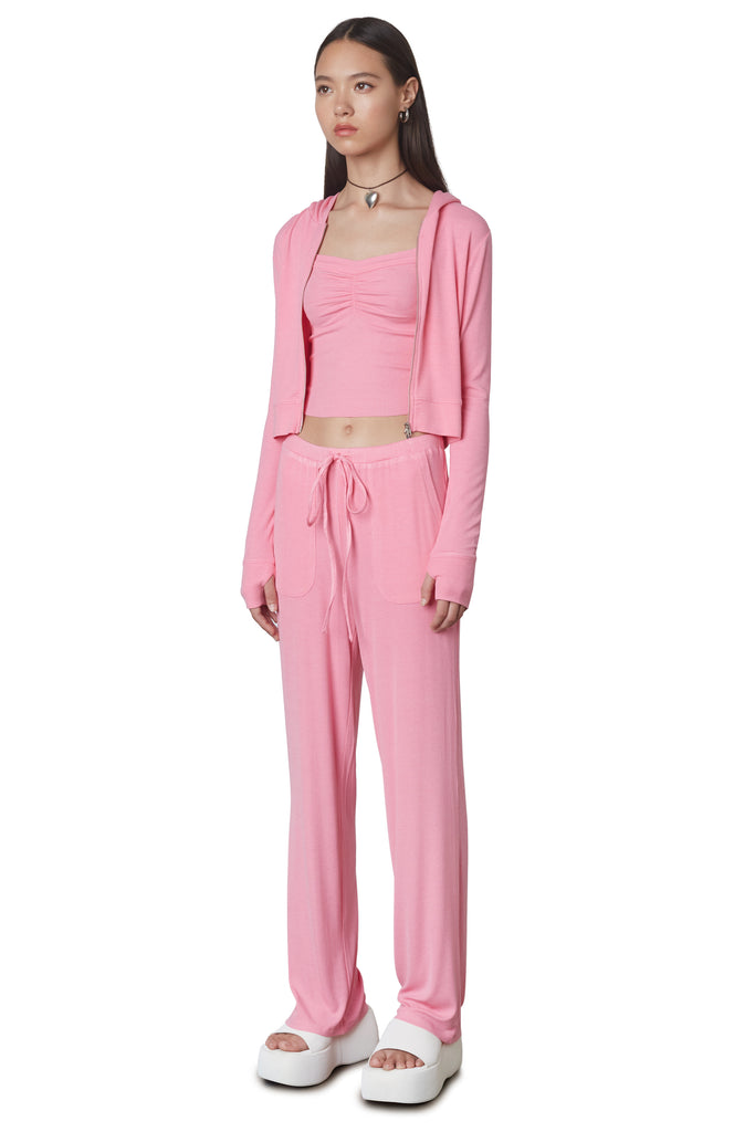 West Lounge Pant in Bubble Gum: Mid-rise straight leg lounge pant with elastic waistband and drawstring. Side view.