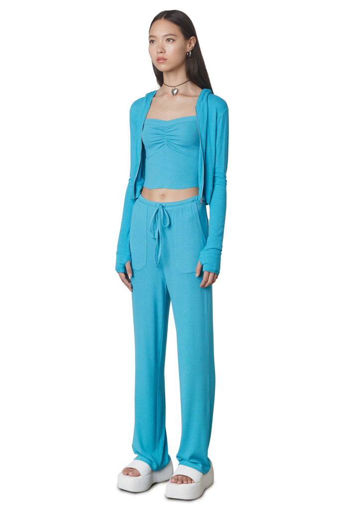 West Lounge Pant in Capri: Mid-rise straight leg lounge pant with elastic waistband and drawstring. Side view.