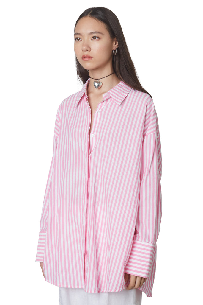 Tony Oversized Shirt in PINK: Oversized button down striped linen shirt with a hidden placket. SIDE view.