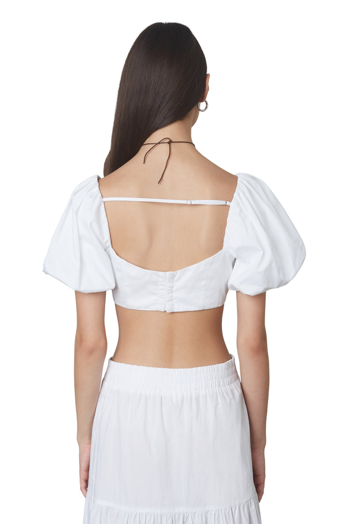 julianne top in white: Puff sleeve fitted crop top with hook and eye closures at back. Fully lined. back view