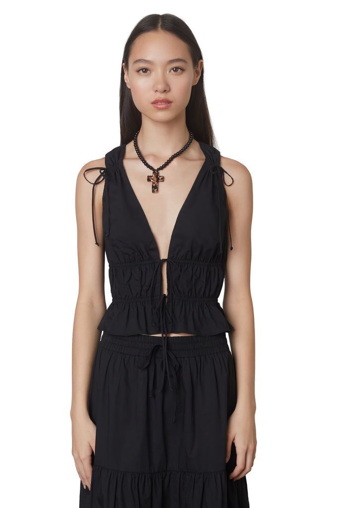 anya top in black: Poplin sleeveless blouse featuring open tie detailing at front and shirring throughout front view