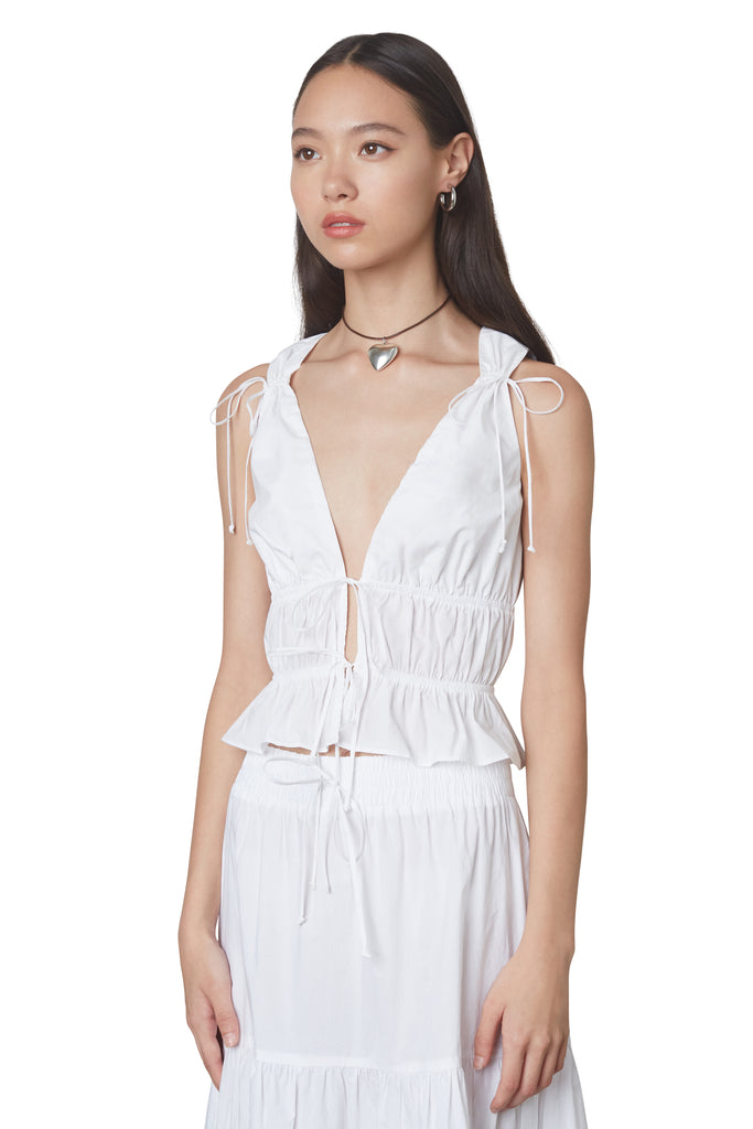 anya top in white: Poplin sleeveless blouse featuring open tie detailing at front and shirring throughout side view