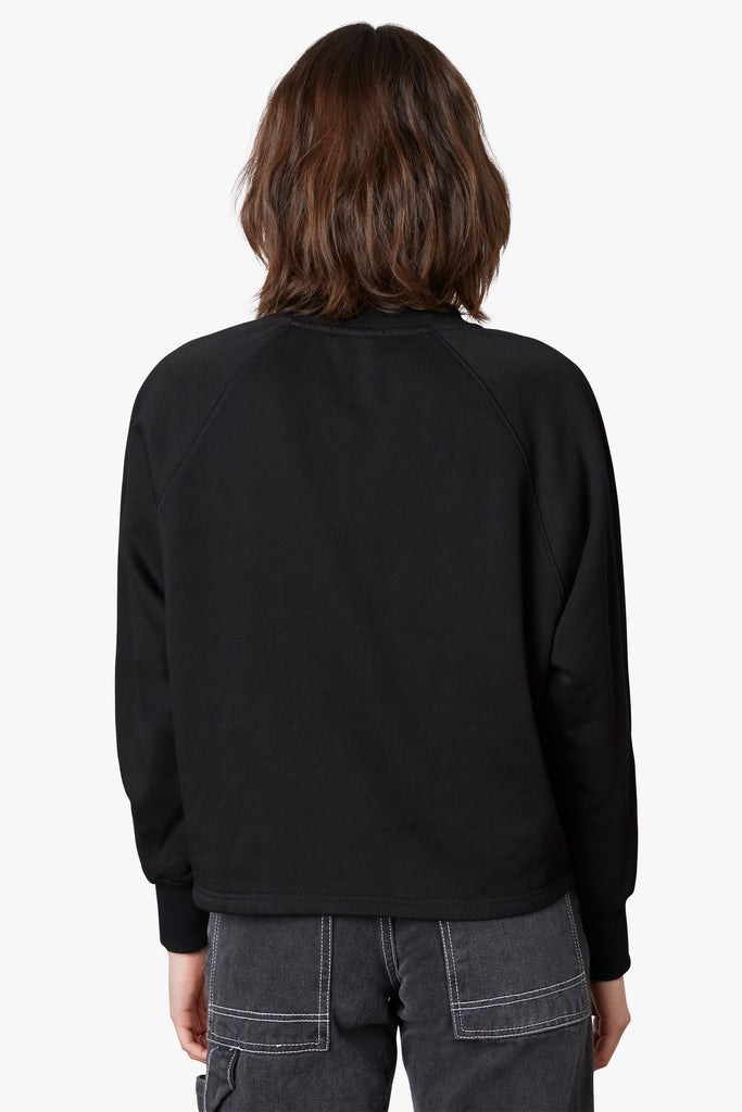 Coco Henley in black, back view