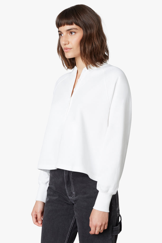 Coco Henley in white, side view